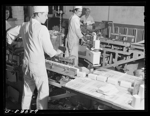 Butter being cut into pound sections for packaging. Land O'Lakes plant, Chicago, Illinois