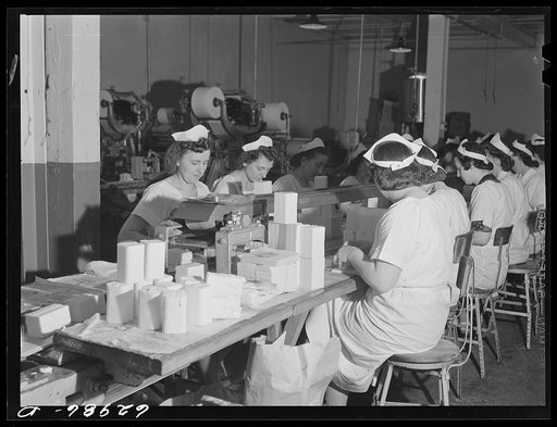 Untitled photo, possibly related to: Wrapping butter by hand. Land O'Lakes plant, Chicago, Illinois