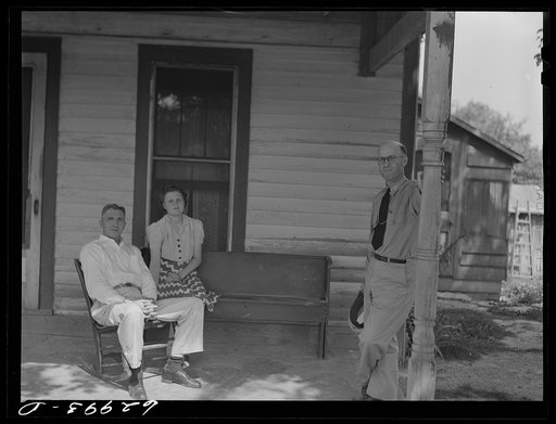 Untitled photo, possibly related to: Lieutenant Sedgewick of United States Navy talking with Luther Corbin, a farmer whose land has been bought by Navy for construction of ammunition depot. Martin County, Indiana