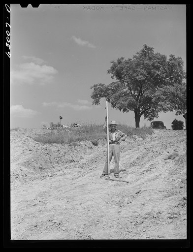 Untitled photo, possibly related to: Surveyors at work in Martin County, Indiana where naval ammunition depot is being constructed on 42,000 acre tract. 160 families will be displaced