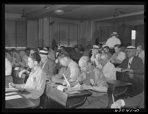 Commission merchants and their agents at early morning auction at fruit terminal. Chicago, Illinois. Auctions are held every morning but Sunday