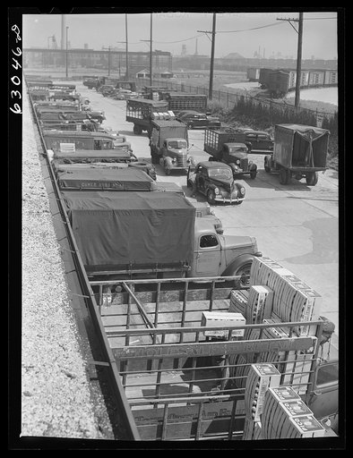 Untitled photo, possibly related to: Trucks of commission merchants lined up outside fruit terminal to haul produce market what has been bought at auction. Chicago, Illinois