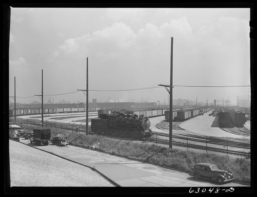 Untitled photo, possibly related to: Trucks of commission merchants lined up outside fruit terminal to haul produce market what has been bought at auction. Chicago, Illinois