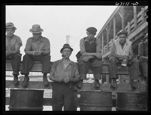 Stockyard workers during lunch hour. Chicago, Illinois