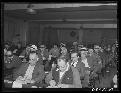 Commission merchants and their agents at early morning auction at fruit terminal. Chicago, Illinois. Auctions are held daily except Sunday