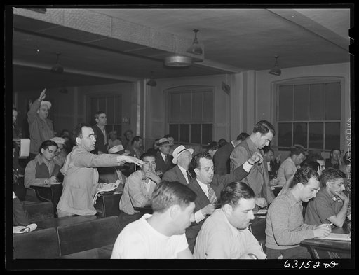 Commission merchants and their agents at early morning auction at fruit terminal. Chicago, Illinois. Auctions are held daily except Sunday