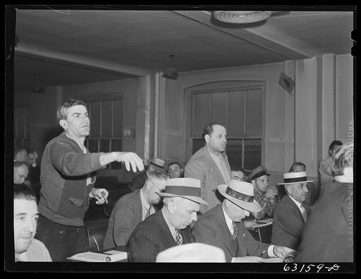 Commission merchants bidding on carload of fruit. Fruit terminal auction room. Chicago, Illinois