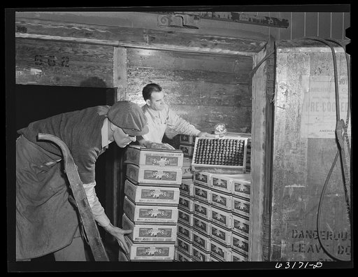 Unloading car of fruit at terminal warehouse in Chicago, Illinois