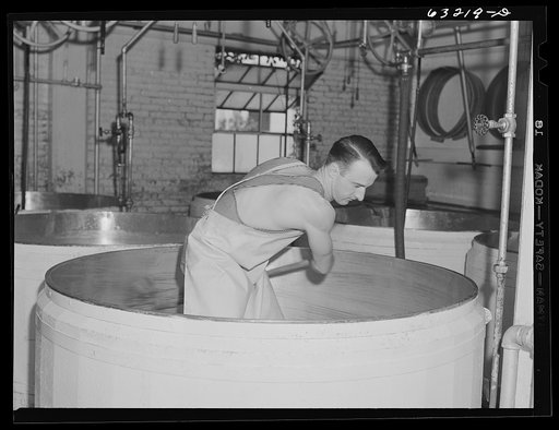 Cleaning out vat in which swiss cheese is made. Madison, Wisconsin