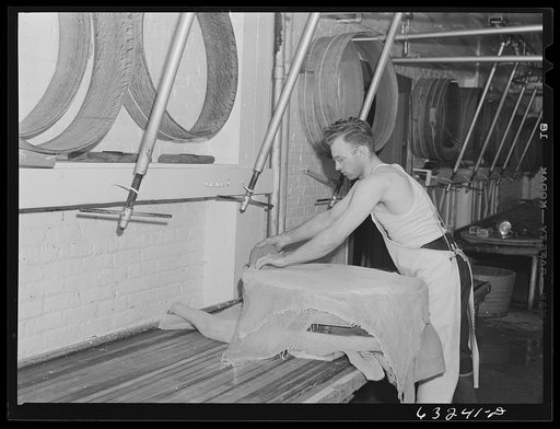 Placing cheese cloth over the curd. Swiss cheese factory. Madison, Wisconsin