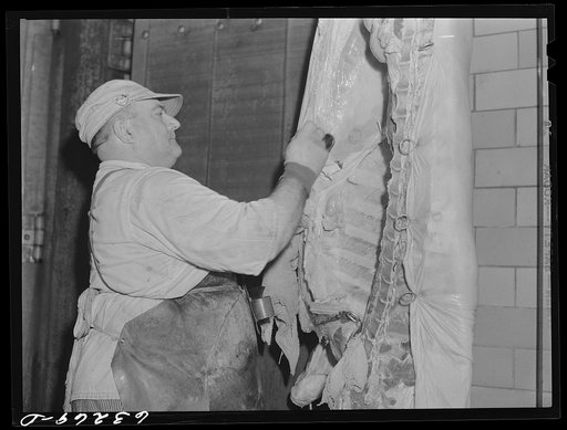 Putting government stamp on carcass of inspected beef. Hormel plant, Austin, Minnesota
