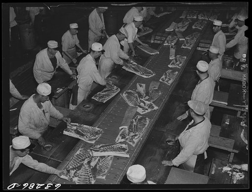 The hog cut. Hogs come chilled and split and go through this crew of butchers on a moving belt. Packing plant, Austin, Minnesota