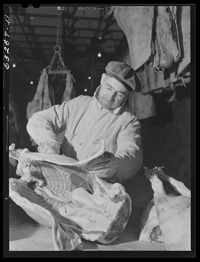 Butcher on the beef cut. Packing plant, Austin, Minnesota