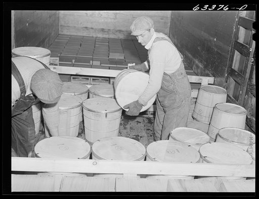 Untitled photo, possibly related to: Loading tubs of butter onto freight car. Land O'Lakes plant. Minneapolis, Minnesota
