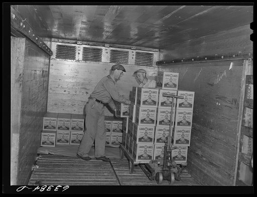 Loading packaged butter onto freight car. Land O'Lakes plant, Minneapolis, Minnesota