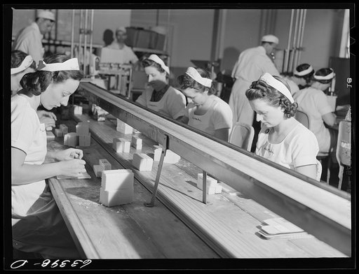 Untitled photo, possibly related to: Packing butter cut into squares for use in restaurants. Land O'Lakes plant, Minneapolis, Minnesota
