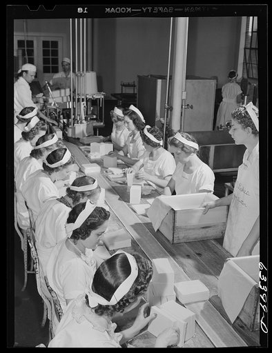 Untitled photo, possibly related to: Packing butter cut into squares for use in restaurants. Land O'Lakes plant, Minneapolis, Minnesota