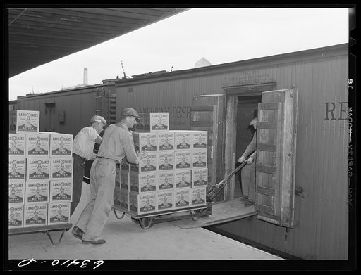 Loading packaged butter onto freight car. Land O'Lakes plant, Minneapolis, Minnesota