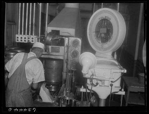 Receiving and weighing milk at creamery. Antigo, Wisconsin