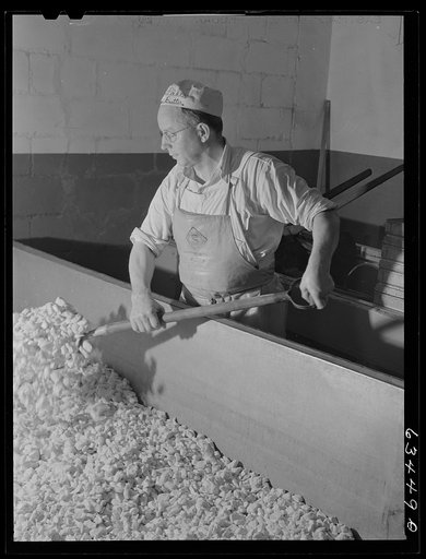 Mixing the curd. American Cheese plant, Antigo, Wisconsin