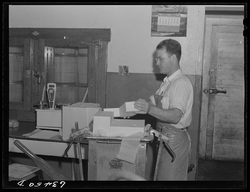Untitled photo, possibly related to: Weighing cream. Antigo, Wisconsin
