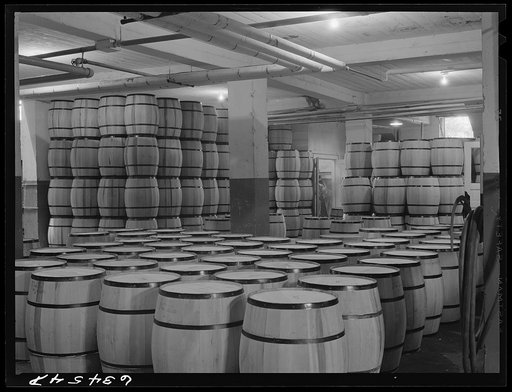 Barrels of powdered milk at condensary. Antigo, Wisconsin