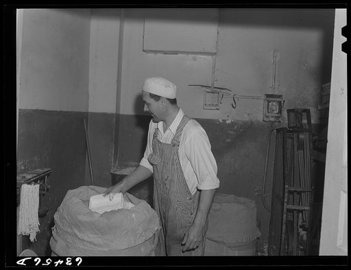 Weighing barrel of powdered milk. Condensary at Antigo, Wisconsin