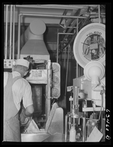 Untitled photo, possibly related to: Taking a sample from can of milk to determine butterfat content. Antigo, Wisconsin