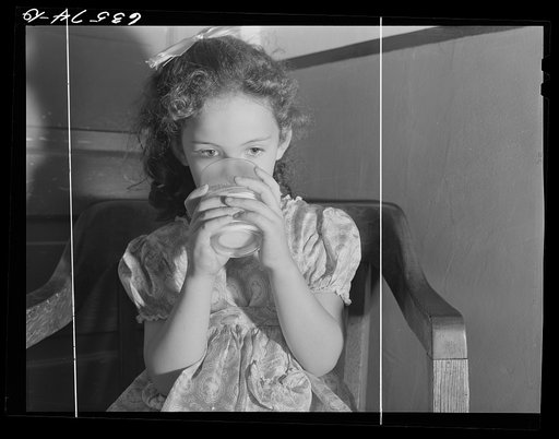 Child drinking milk. Duluth, Minnesota