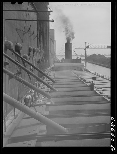 Loading grain boat at Consolidated Elevator Compamy, elevator "E". Duluth, Minnesota