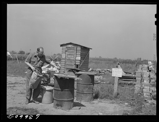 Men's toilet and garbage disposal facilities in Daniels trailer park where many defense workers live. Outskirts of Detroit, Michigan