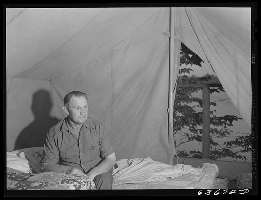 Mr. Akers, construction worker from Flint, Michigan now working at Ford bomber plant near Ypsilanti. He lives in a tent with two other men at Edgewater Park. Edgewater Park normally closes on Labor Day. This year it will remain open through the winter