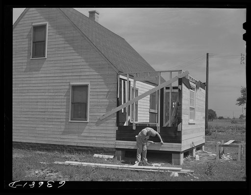 Defense worker who is on the night shift spends his day working on a new home he is building on outskirts of Detroit, Michigan