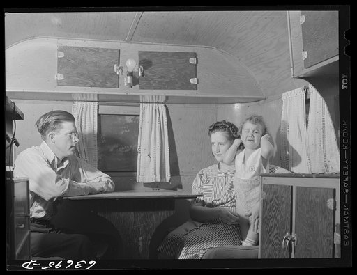 Untitled photo, possibly related to: Mr. and Mrs. Birch and family in trailer in Edgewater trailer camp near Ypsilanti, Michigan. Mrs. Birch and the children share the trailer with another family. Mr. Birch lives in a tent nearby with two men. Rent: six dollars a week for trailer space; five dollars