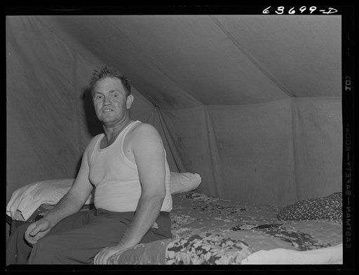 Untitled photo, possibly related to: Mr. Akers, construction worker from Flint, Michigan now working at Ford bomber plant near Ypsilanti. He lives in a tent with two other men at Edgewater Park. Edgewater Park normally closes on Labor Day. This year it will remain open through the winter