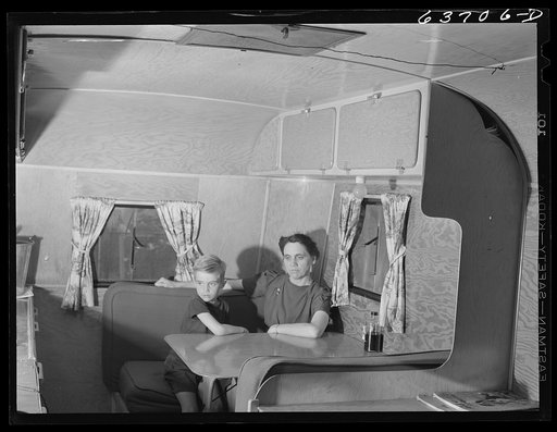Mrs. Nichols, wife of defense worker, and son, in their trailer home at Edgewater Park near Ypsilanti, Michigan. They are from Casa City, Michigan