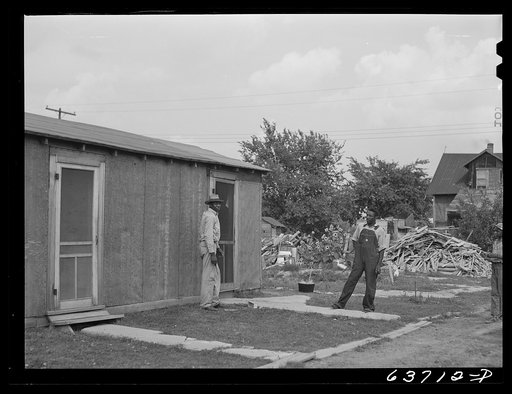 Negro defense workers living in a Negro settlement near Detroit, Michigan