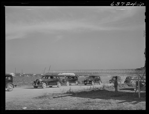 Untitled photo, possibly related to: Change of shift traffic leaving Ford bomber plant near Ypsilanti, Michigan