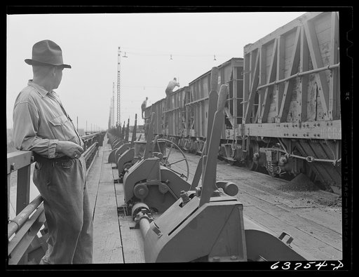 On top of the ore docks, Allouez, Wisconsin. Leavers control the chutes which load ore into hold of ship