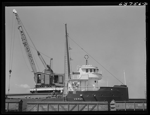 Loading scrap iron on Great Lakes boat. Superior, Wisconsin