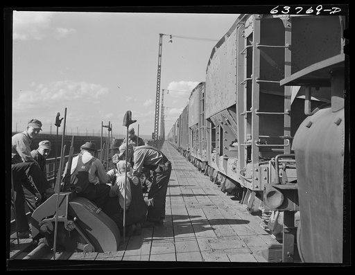 Untitled photo, possibly related to: On top of the ore docks, Allouez, Wisconsin. Leavers control the chutes which load ore into hold of ship