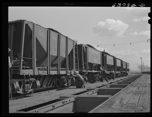 Cars of iron ore being emptied into bins on ore docks. Allouez, Wisconsin