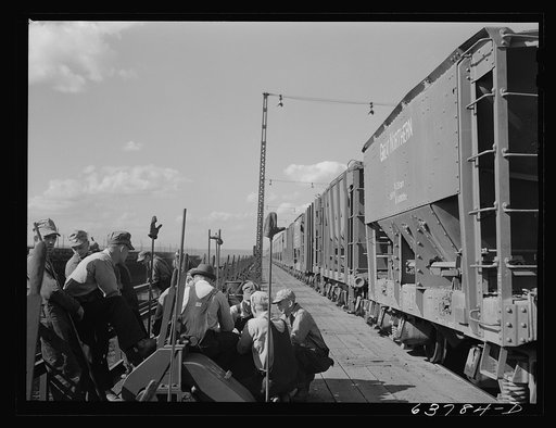 Ore punchers waiting for signal to begin unloading cars of ore into bins on dock. Allouez, Wisconsin