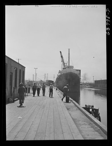 Part of lake boat crew going into town while boat is docked to take on grain. Superior, Wisconsin