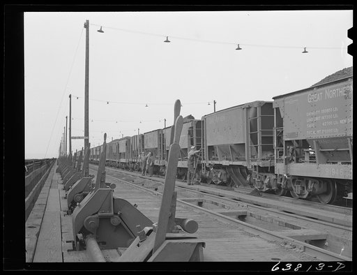 Untitled photo, possibly related to: On top of the ore docks, Allouez, Wisconsin. Leavers control the chutes which load ore into hold of ship