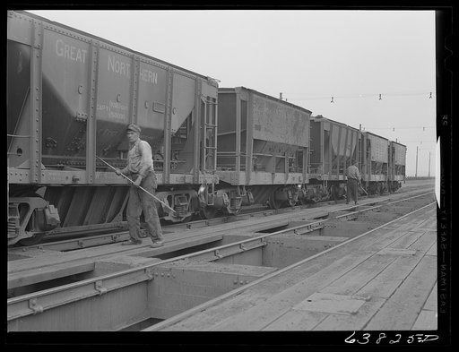 Untitled photo, possibly related to: Cars of iron ore being emptied into bins on ore docks. Allouez, Wisconsin