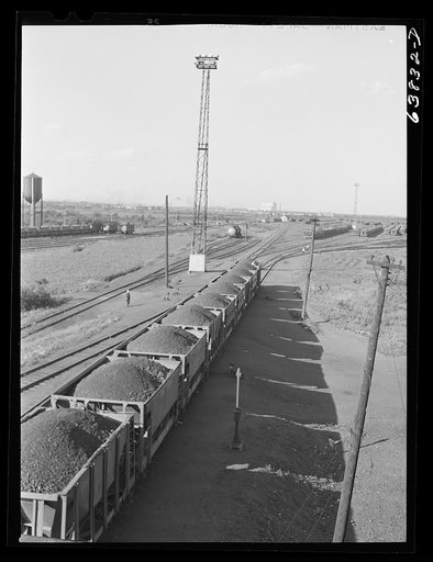 Cars of iron ore passing through the scales at Great Northern Railroad yards. Superior, Wisconsin