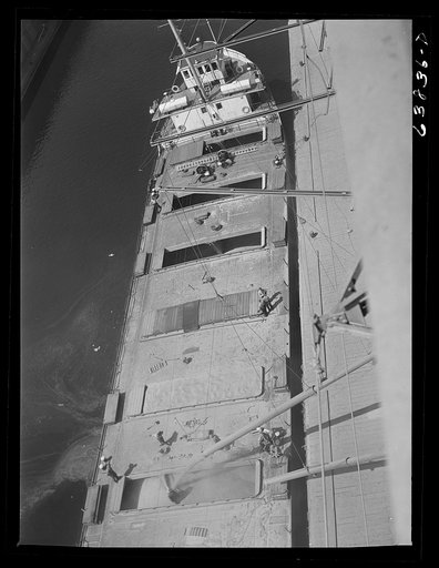 Grain boat being loaded at elevator. Superior, Wisconsin