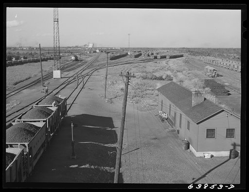 Untitled photo, possibly related to: Cars of iron ore passing through the scales at Great Northern Railroad yards. Superior, Wisconsin