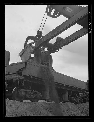 Untitled photo, possibly related to: Electric power shovels scoop up iron ore; eight cubic yards per shovelful. Albany Mine near Bovey, Minnesota